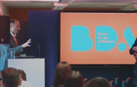 Man speaking at BDA conference in 2018