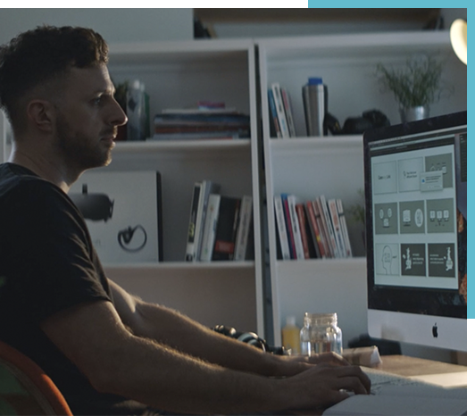 Man designing in InDesign