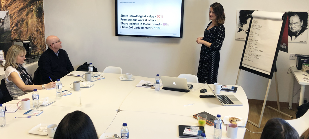 Lady presenting in a workshop