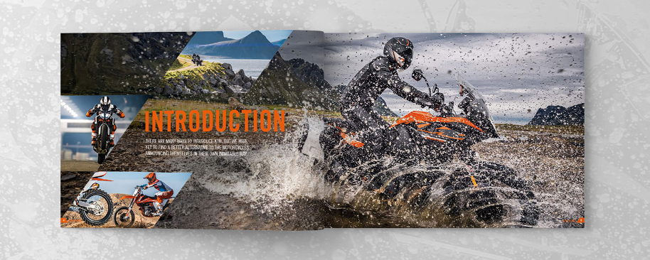 KTM printed brochure on grey splattered background