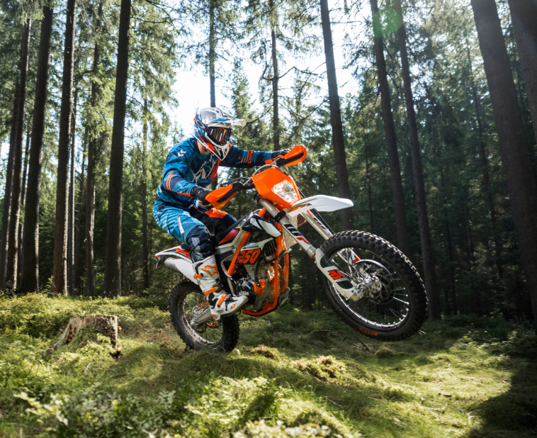 KTM motorcycle being ridden in woods