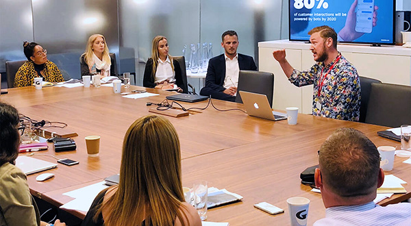 Man presenting web and mobile presentation to clients.