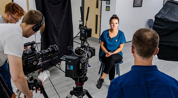 Lady being interviewed and filmed