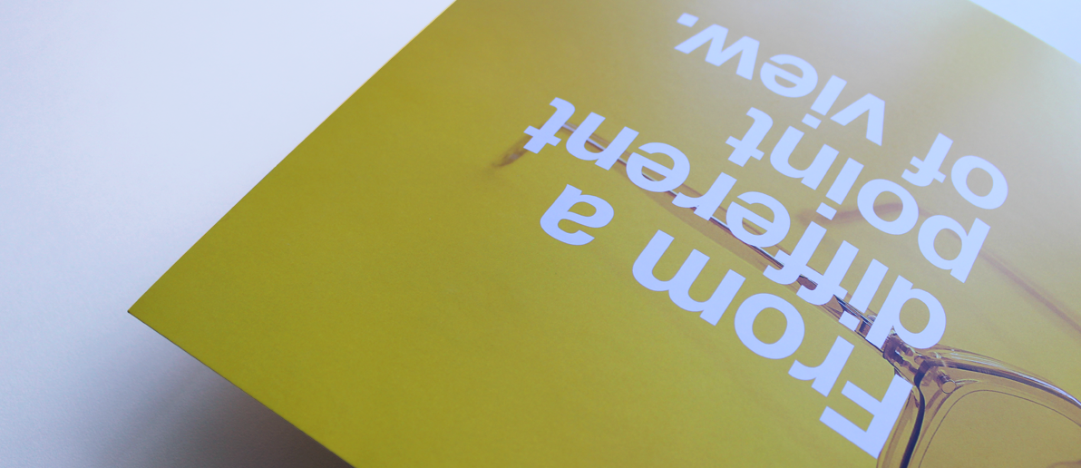 Yellow printed brochure saying from a different point of view 